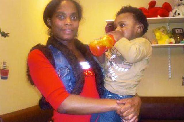 Afriyie Gaspard holding her son Izayah Hall